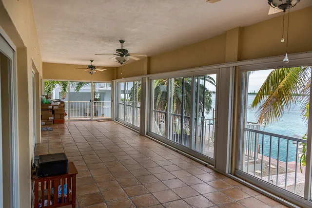 a view of a hall with living room and windows