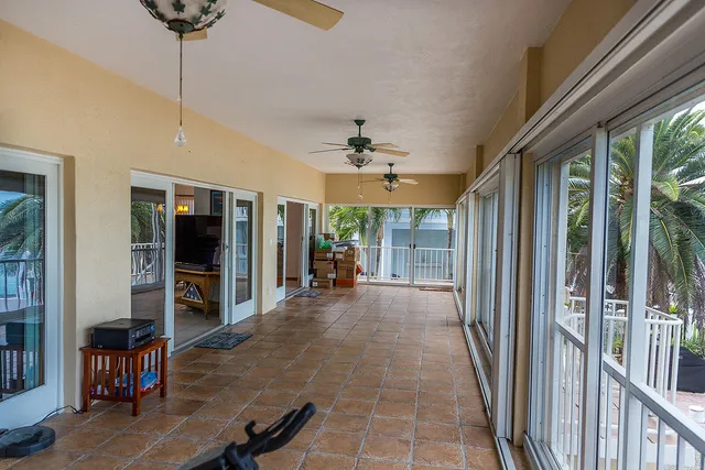 a view of a house with backyard and swimming pool