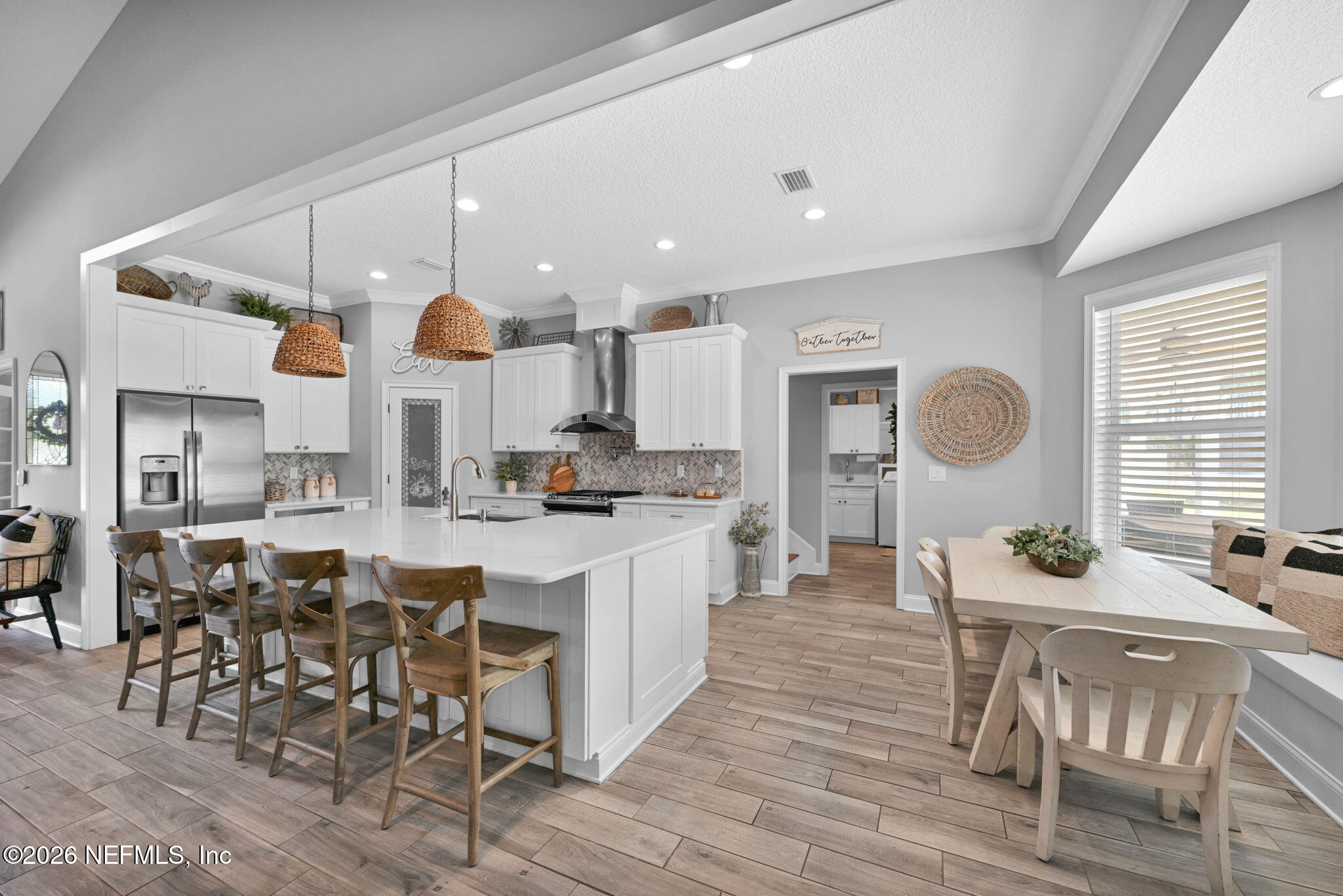 34446 Mitigation Trail Callahan, FL 32011 - Photo 17 of 84 a large kitchen with a table and chairs