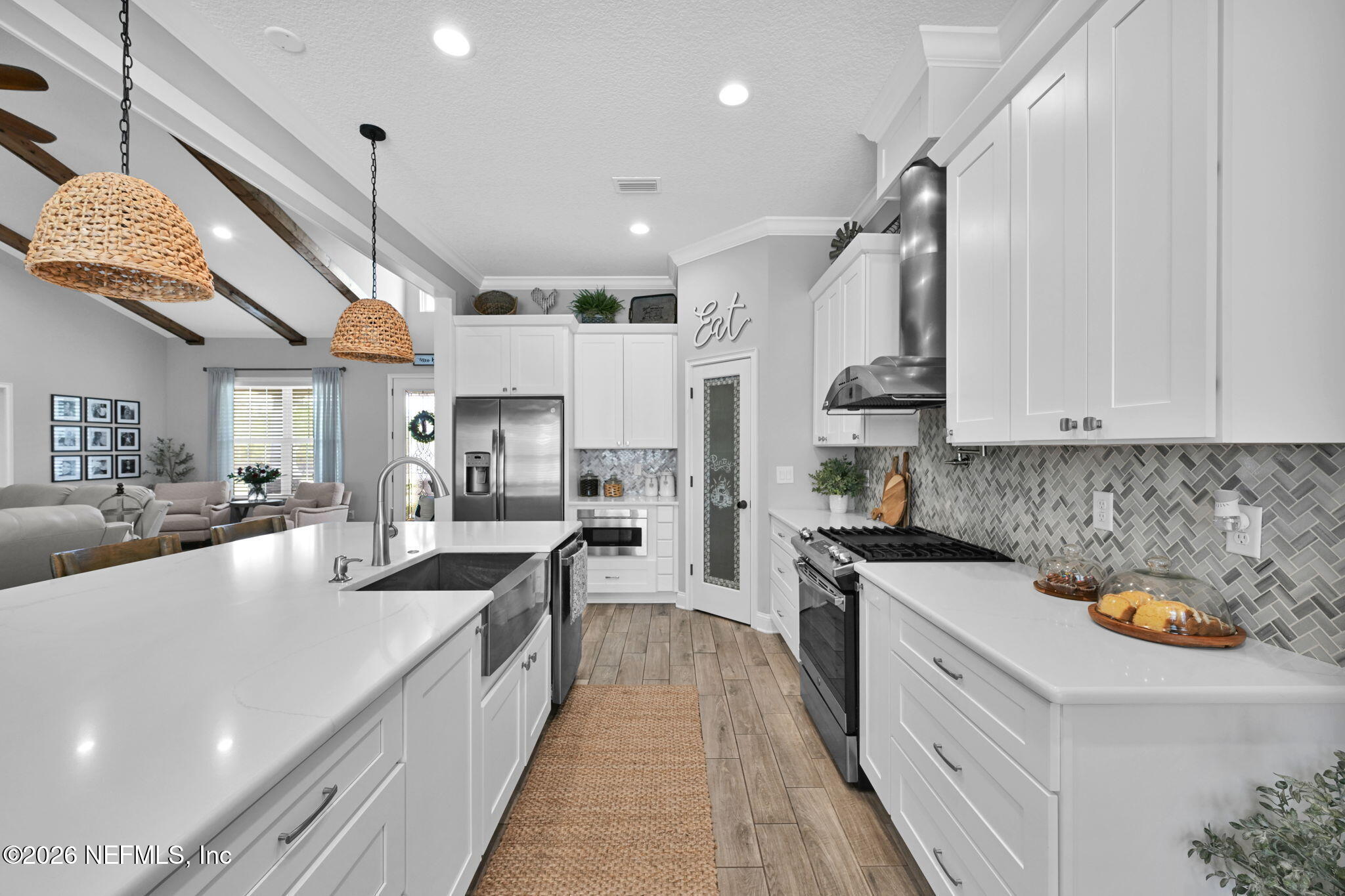 34446 Mitigation Trail Callahan, FL 32011 - Photo 21 of 84 a large kitchen with stainless steel appliances lots of counter space and a sink