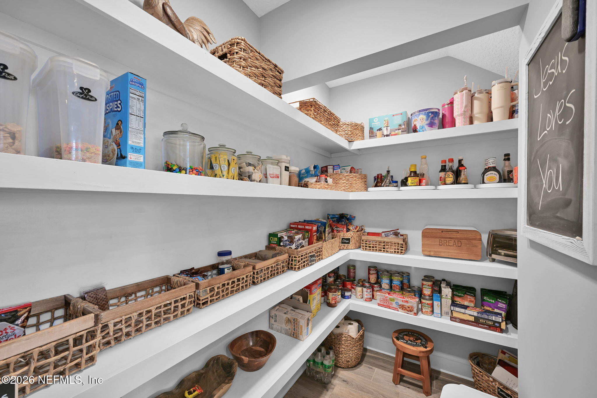 34446 Mitigation Trail Callahan, FL 32011 - Photo 24 of 84 a room with furniture a book shelf and a book shelf