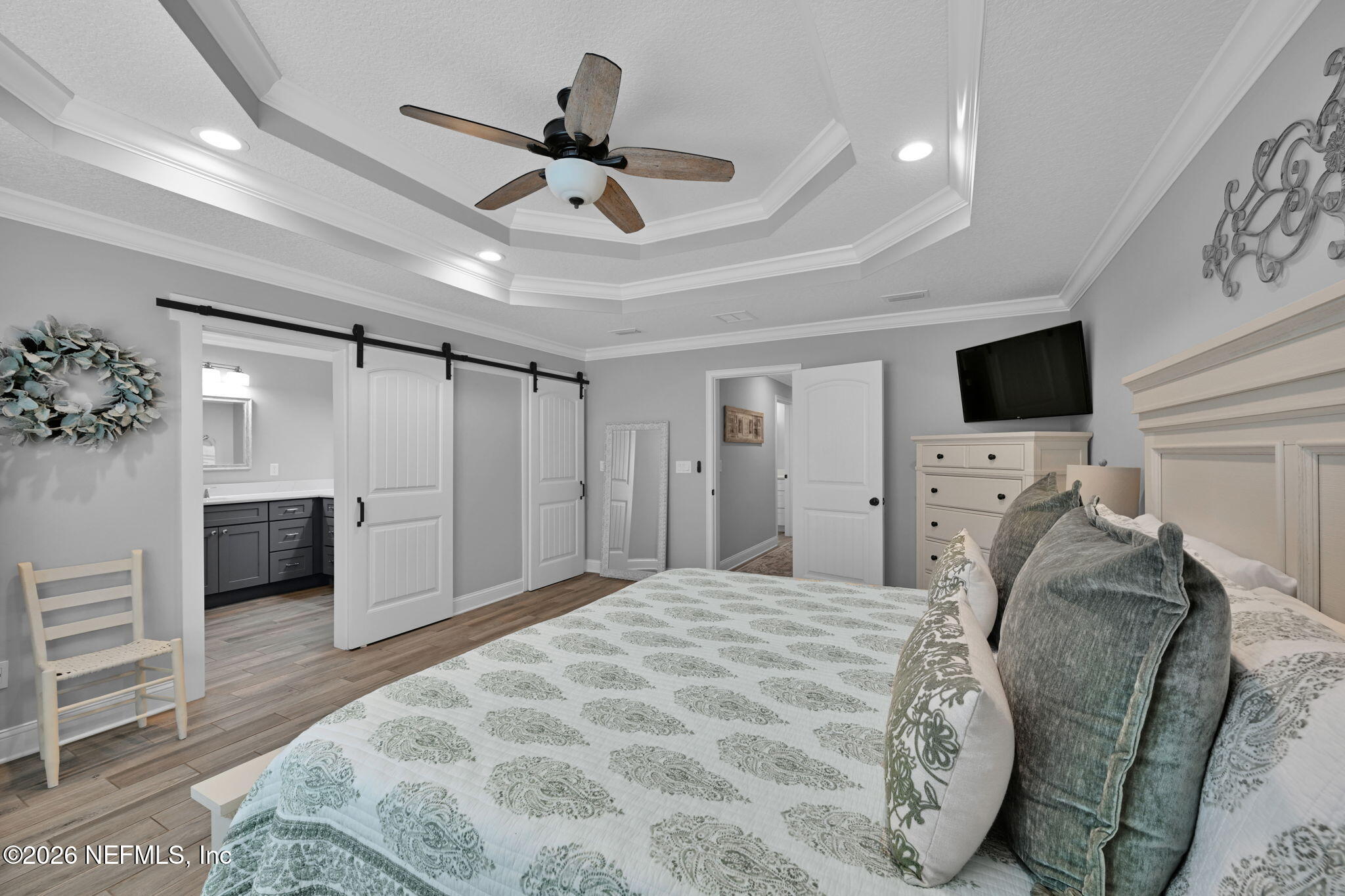 34446 Mitigation Trail Callahan, FL 32011 - Photo 31 of 84 a bedroom with a bed and a flat screen tv