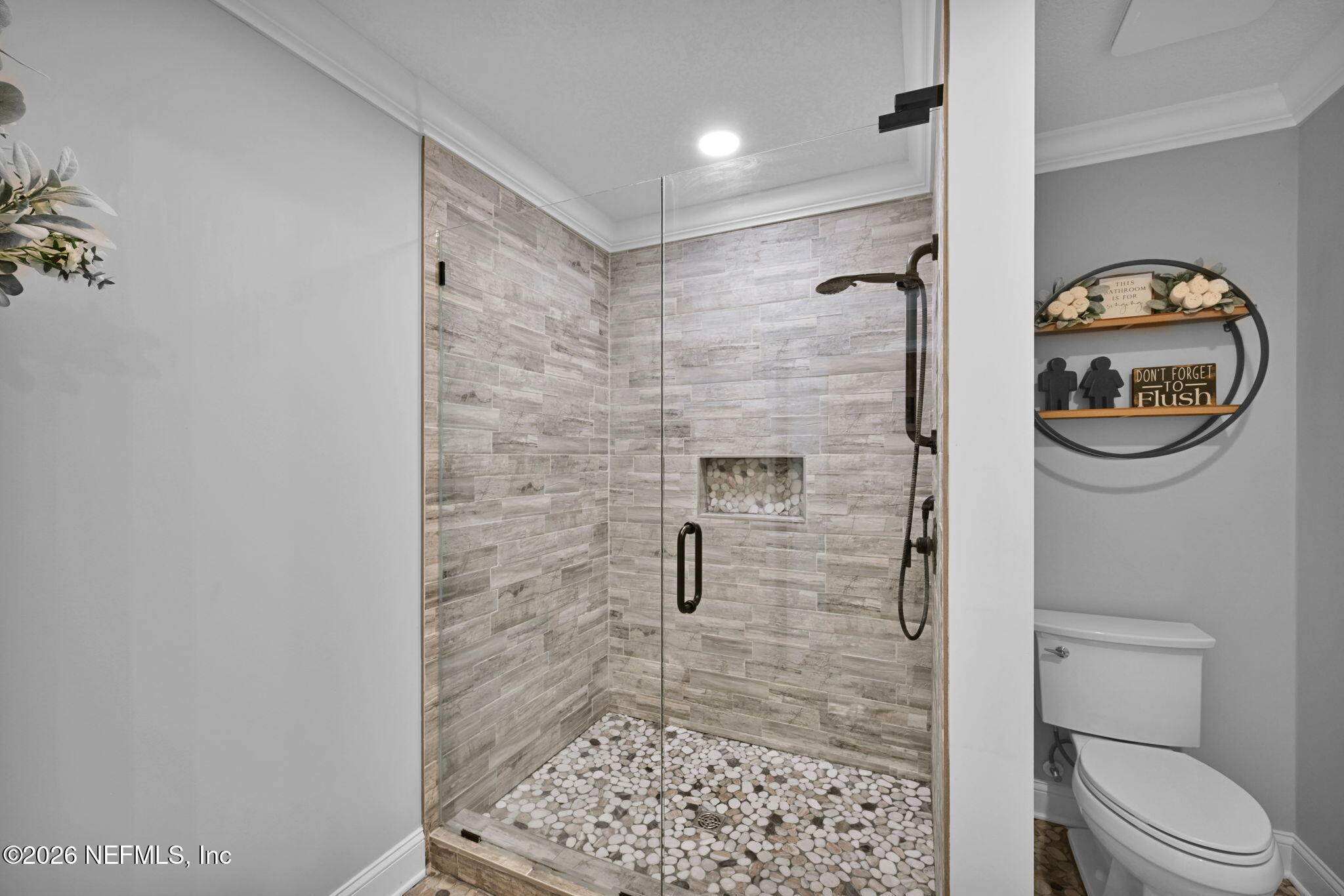 34446 Mitigation Trail Callahan, FL 32011 - Photo 36 of 84 a bathroom with a toilet and a shower