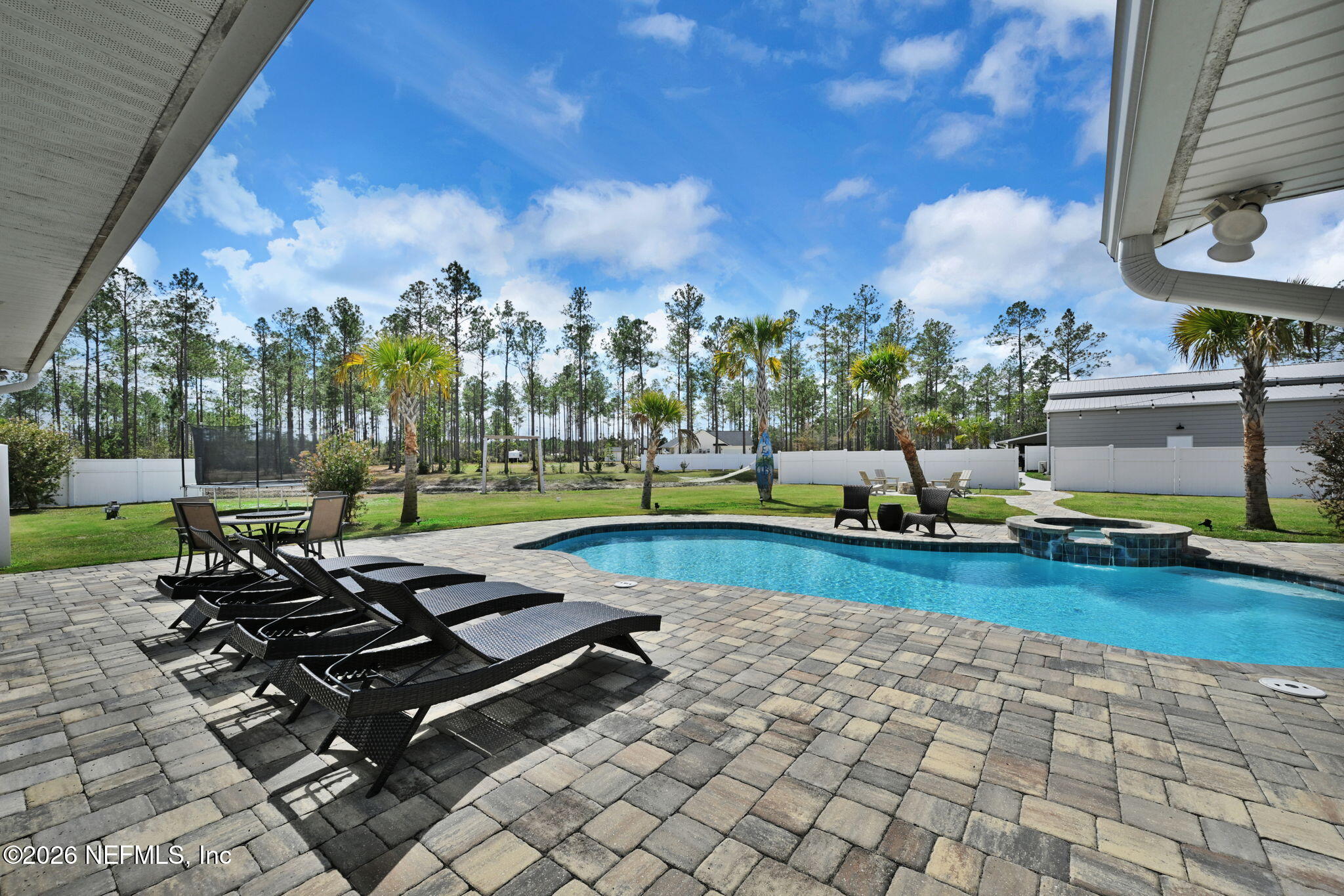 34446 Mitigation Trail Callahan, FL 32011 - Photo 38 of 84 a view of a backyard with sitting area