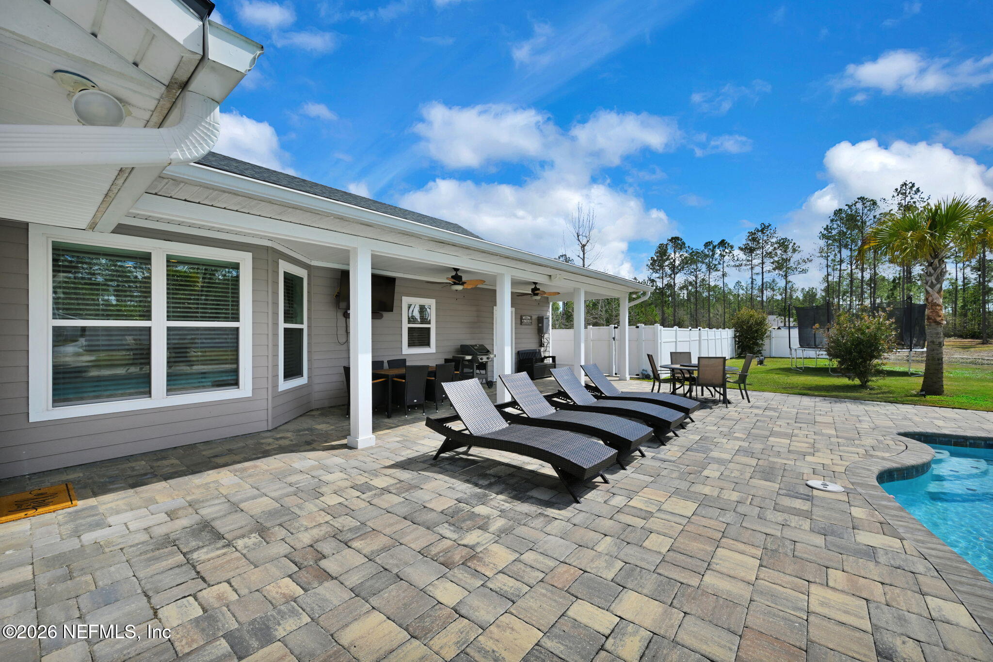 34446 Mitigation Trail Callahan, FL 32011 - Photo 39 of 84 a view of a house with backyard and sitting area