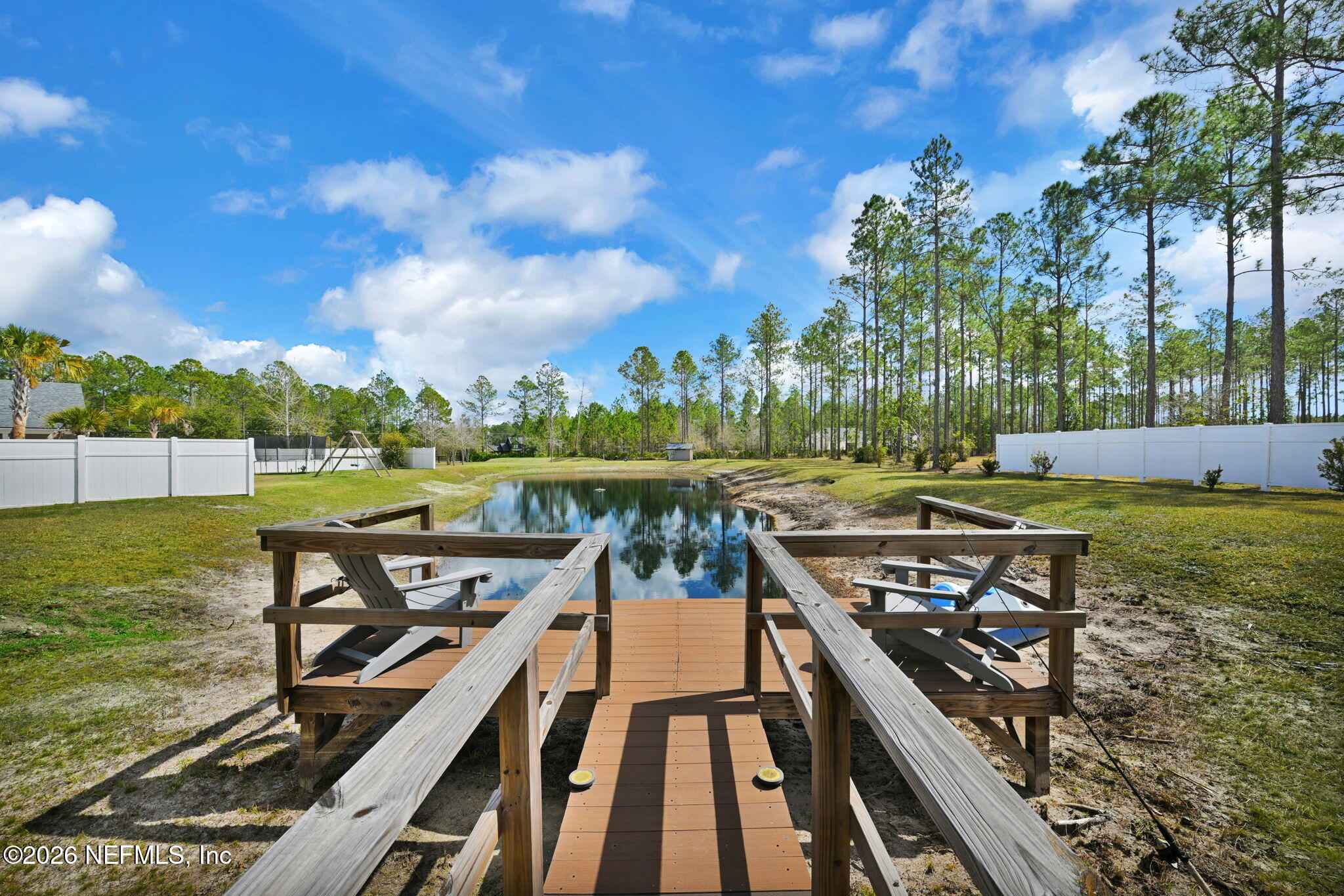 34446 Mitigation Trail Callahan, FL 32011 - Photo 51 of 84 a view of a wooden deck with lake view