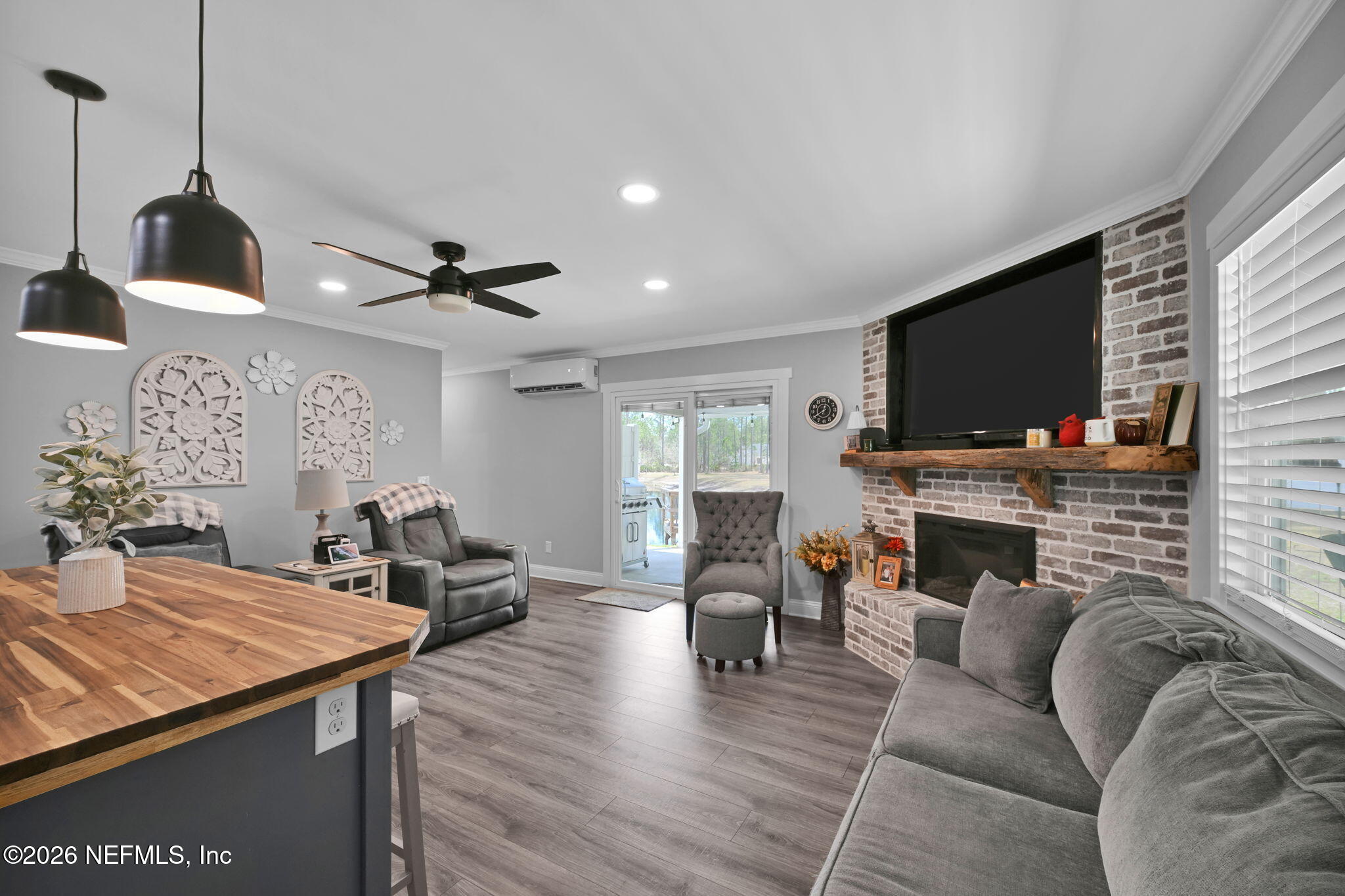 34446 Mitigation Trail Callahan, FL 32011 - Photo 57 of 84 a living room with furniture and a fireplace