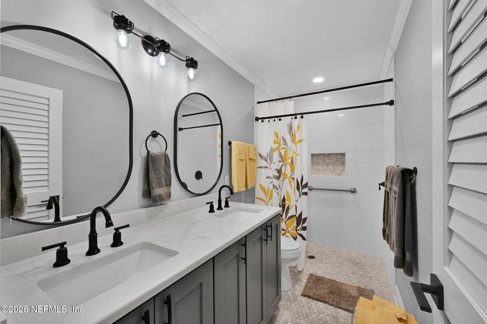 34446 Mitigation Trail Callahan, FL 32011 - Photo 64 of 84 a bathroom with a sink and a mirror