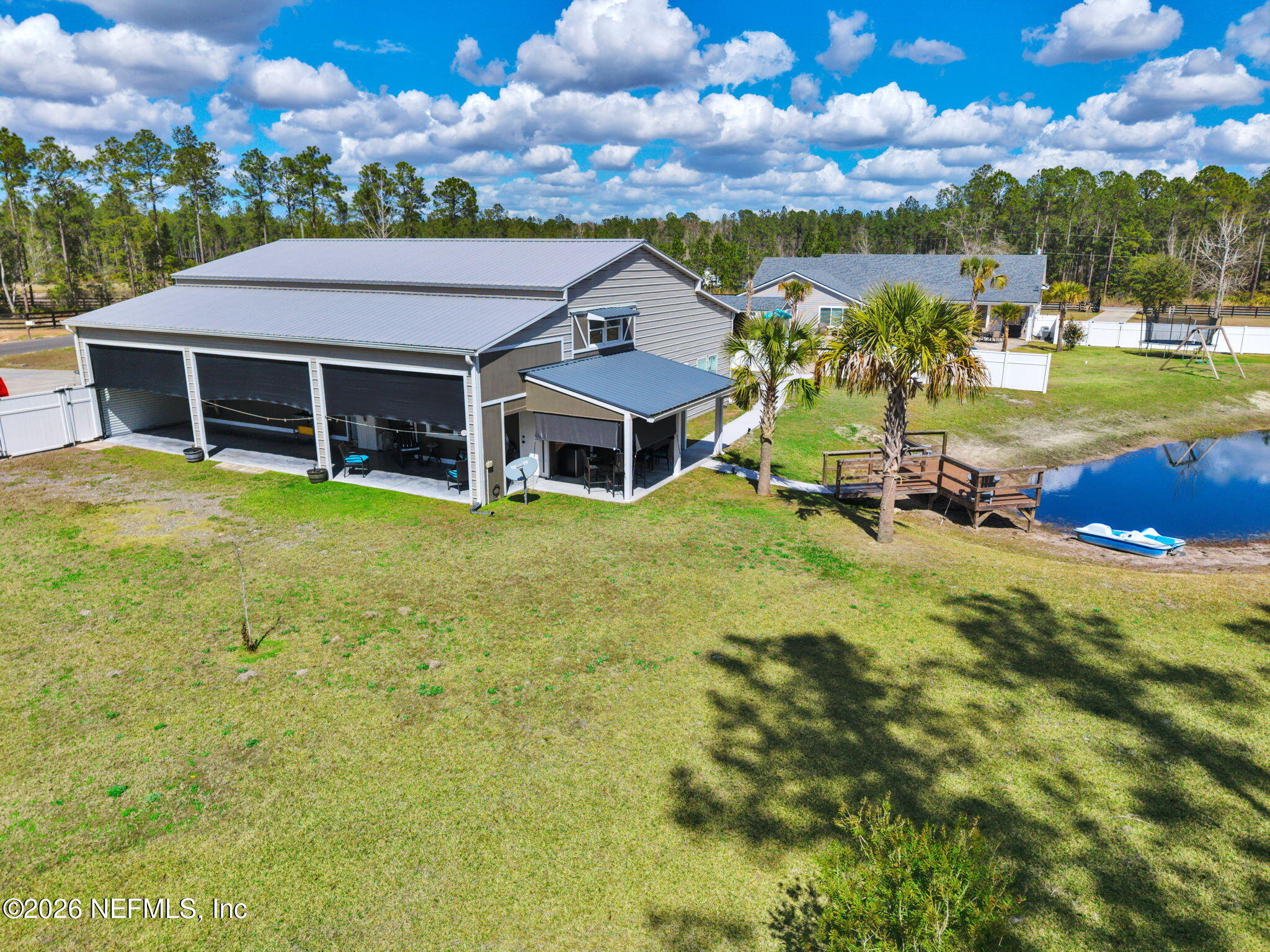 34446 Mitigation Trail Callahan, FL 32011 - Photo 7 of 84 a view of a house with a big yard