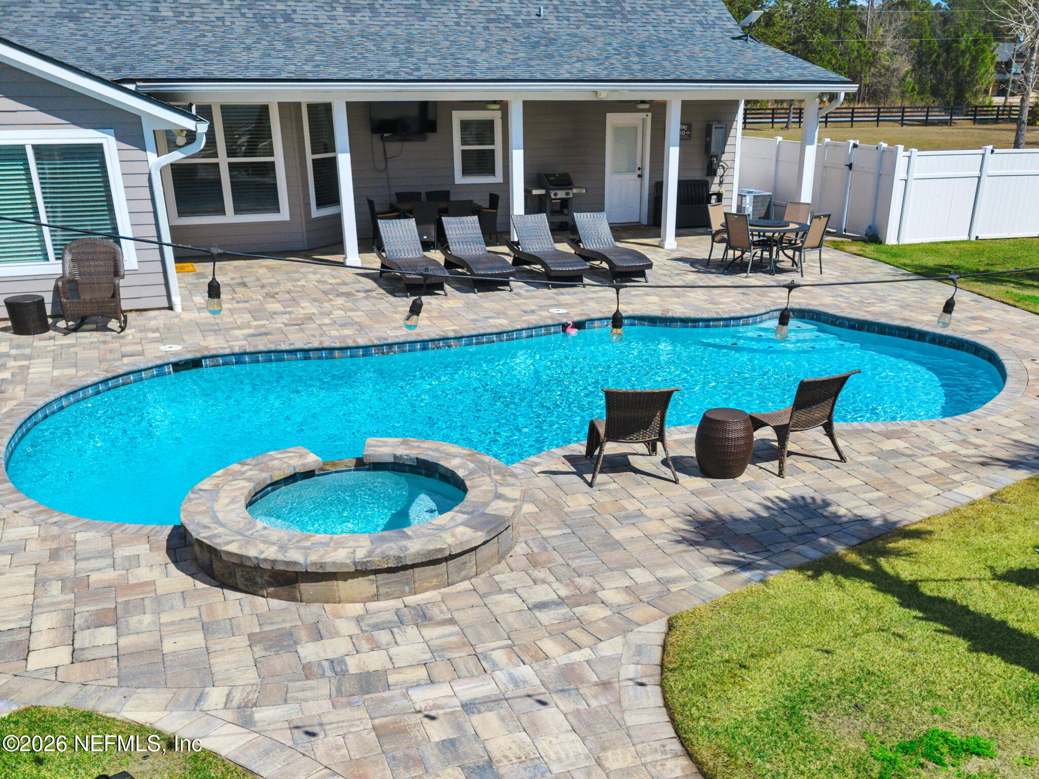 34446 Mitigation Trail Callahan, FL 32011 - Photo 82 of 84 a view of a backyard with swimming pool and furniture