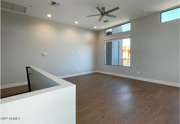 a view of a kitchen with a sink and a window