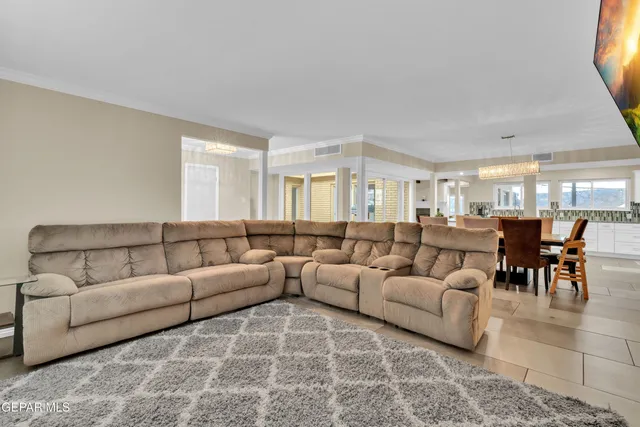 a view of a dining room with furniture and a table