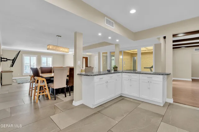 a kitchen with stainless steel appliances granite countertop a refrigerator oven a sink and dishwasher