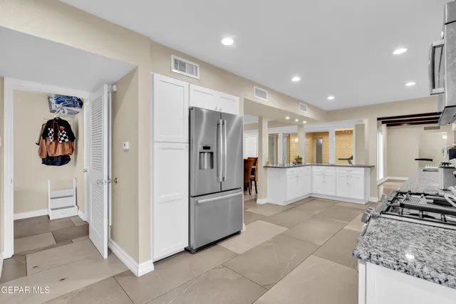 a bathroom with double sink and a mirror