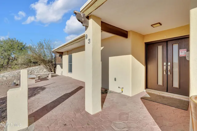 a spacious bathroom with a double vanity sink and a mirror