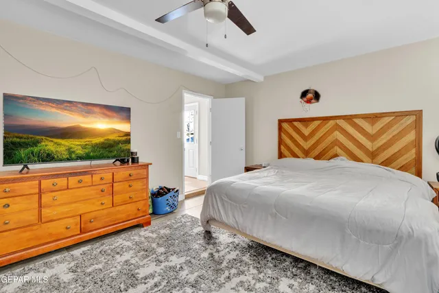 a view of a patio with table and chairs and potted plants