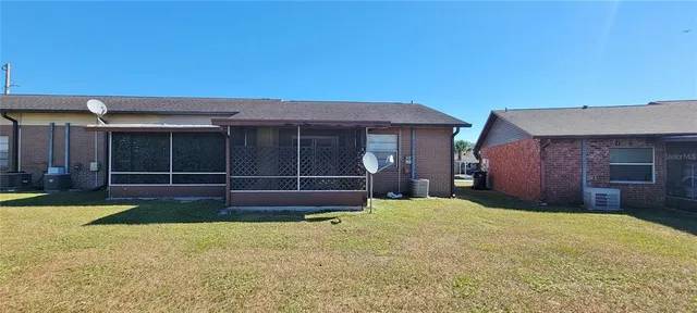 a view of a house with a yard and garage