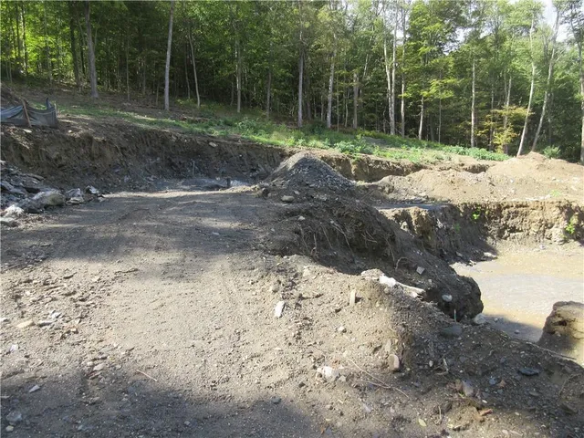 a view of a road with a yard