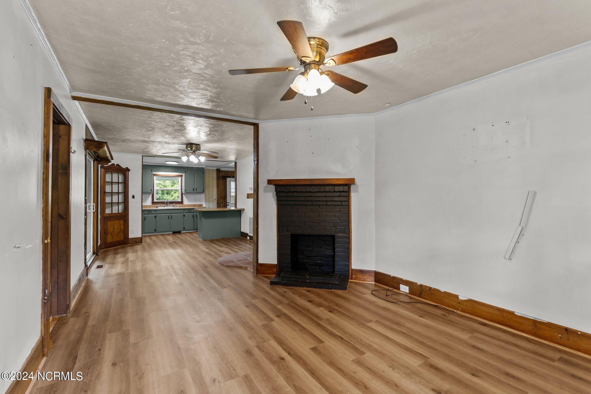 157 Airbase Road Atlantic, NC 28511 - Photo 9 of 49 Living area showing fireplace