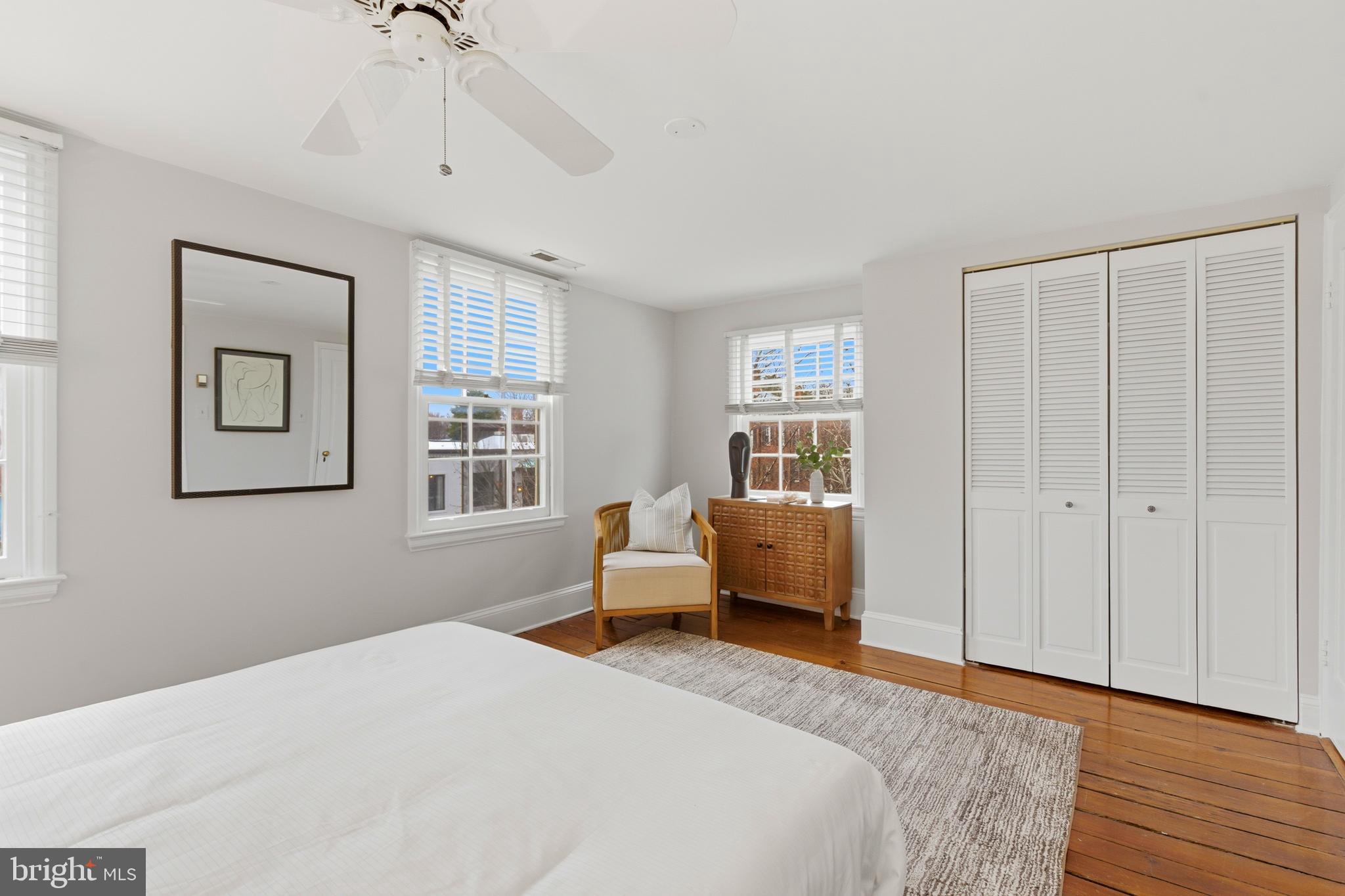 2719 Dumbarton Street Northwest Washington, DC 20007 - Photo 15 of 32 a bedroom with a bed and a window