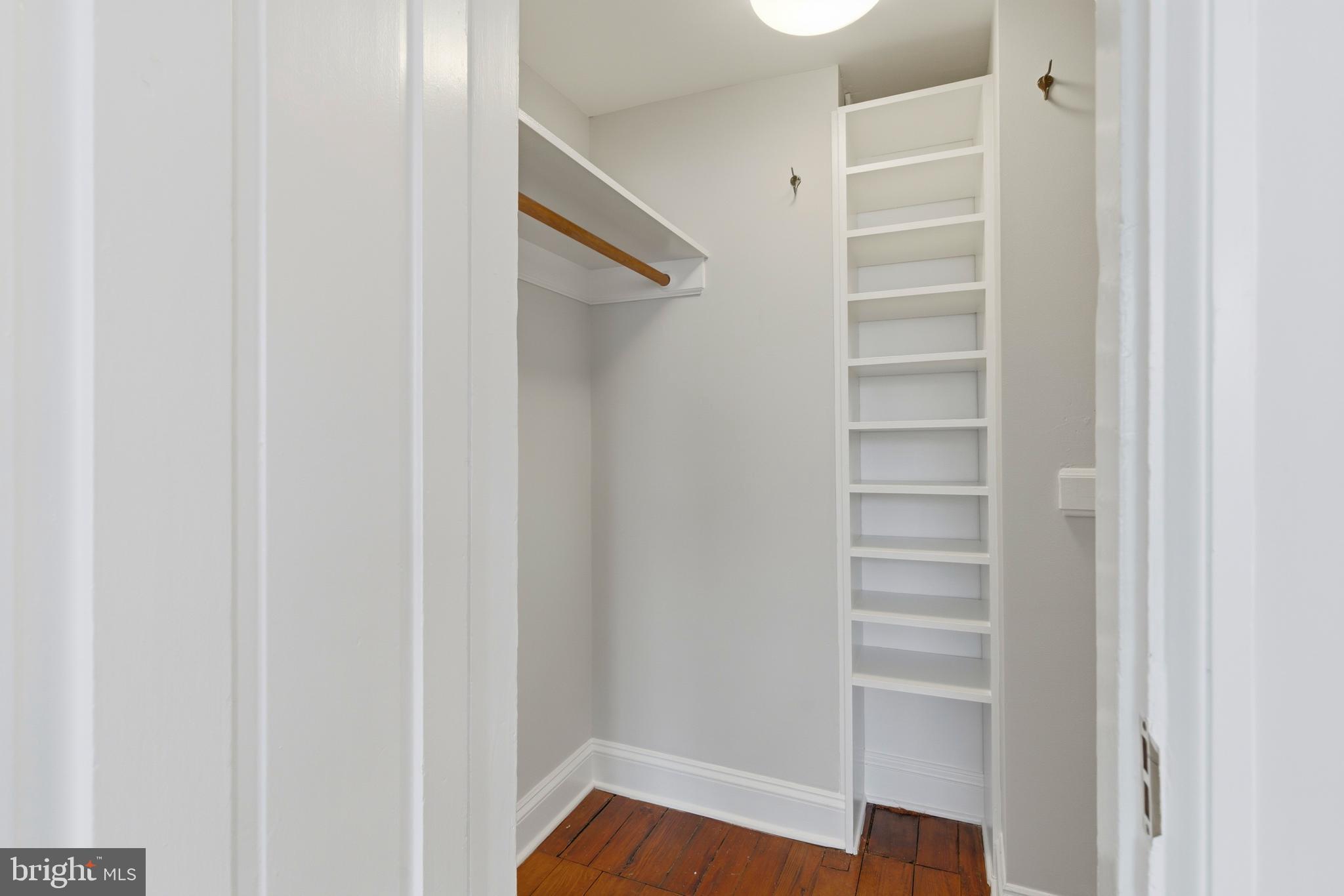 2719 Dumbarton Street Northwest Washington, DC 20007 - Photo 18 of 32 a view of walk in closet with empty racks