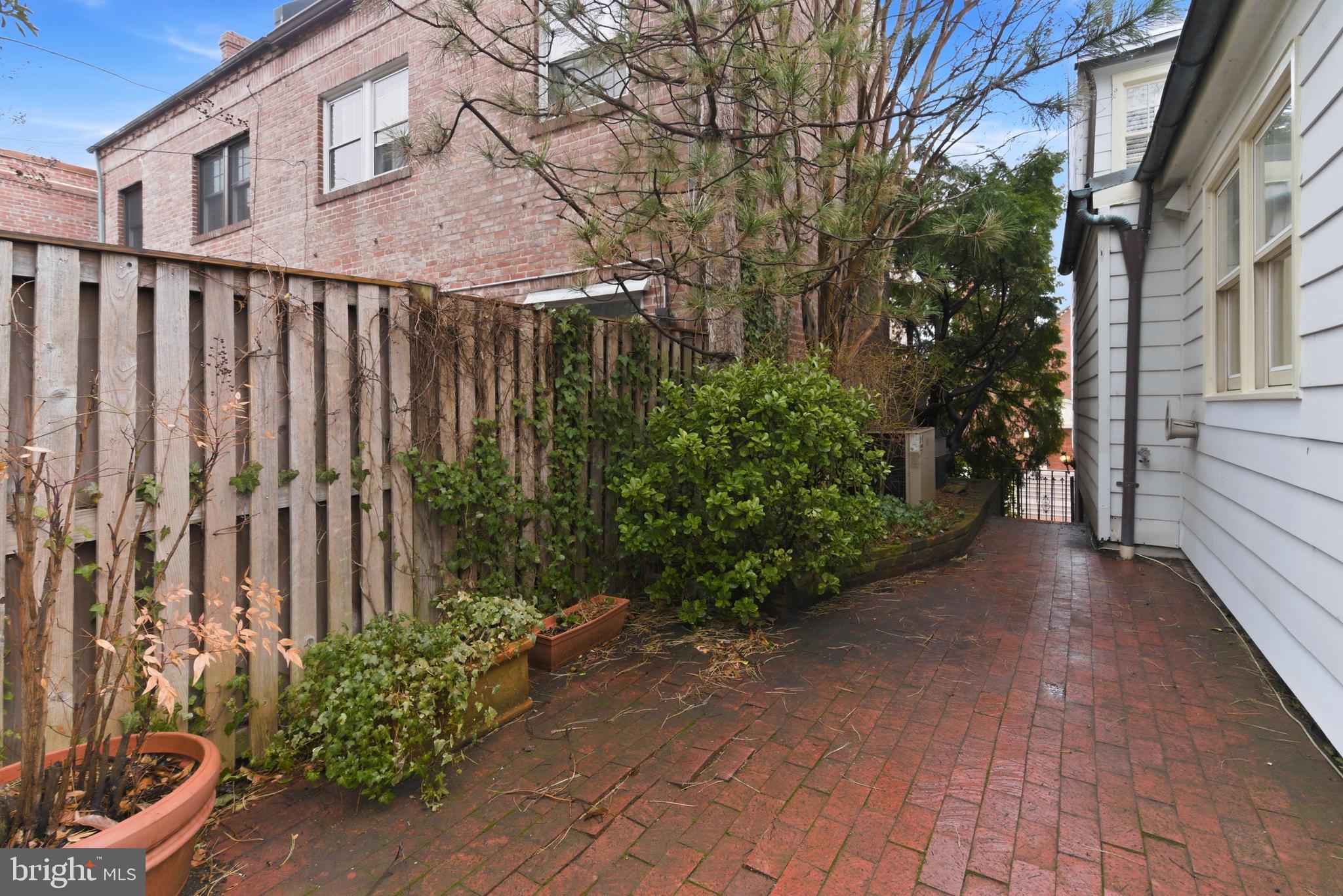 2719 Dumbarton Street Northwest Washington, DC 20007 - Photo 26 of 32 a view of a pathway with a house