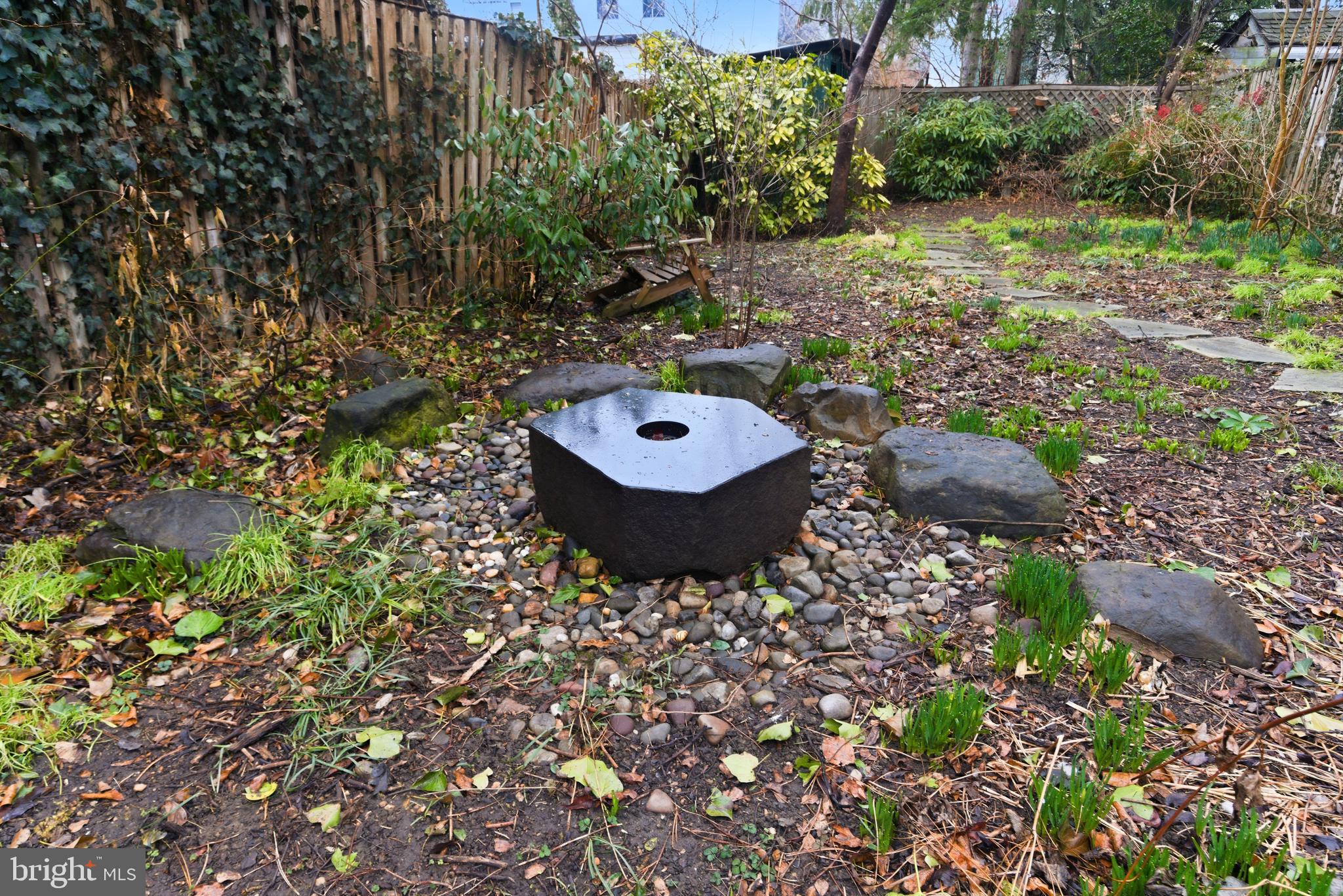 2719 Dumbarton Street Northwest Washington, DC 20007 - Photo 27 of 32 a backyard of a house with yard and outdoor seating