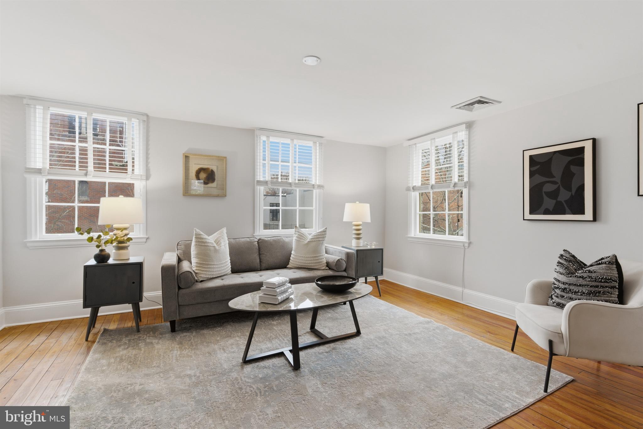 2719 Dumbarton Street Northwest Washington, DC 20007 - Photo 3 of 32 a living room with furniture and windows