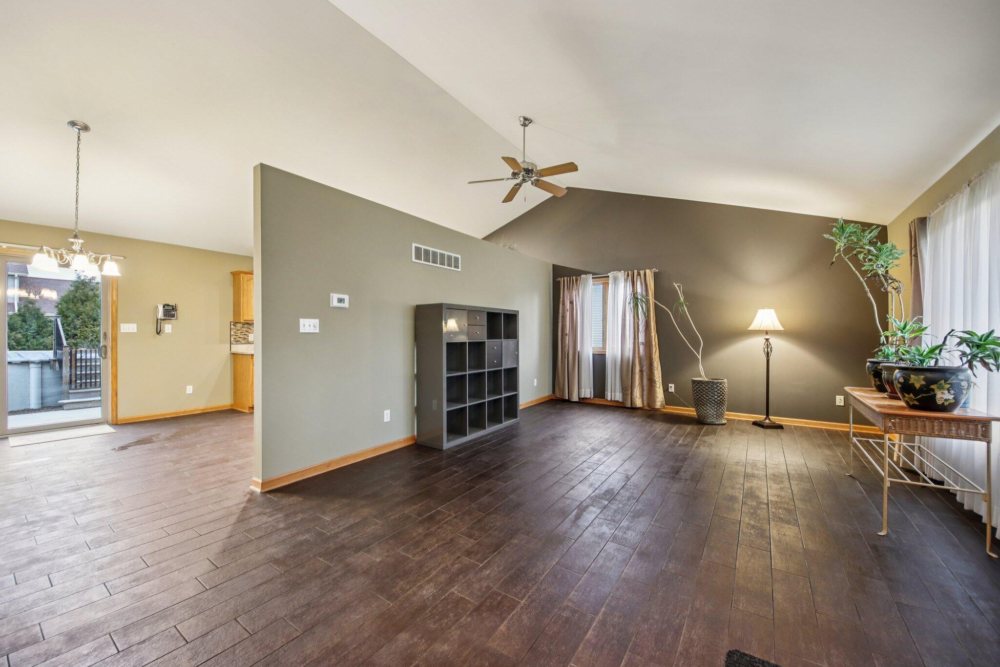9396 Calumet Street Dyer, IN 46311 - Photo 6 of 43 a view of a livingroom with wooden floor and a ceiling fan