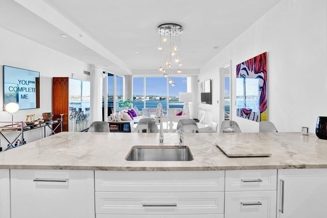 a kitchen with counter top space cabinets and stainless steel appliances