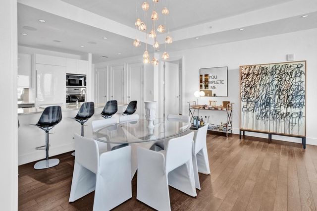 a view of a livingroom with furniture and wooden floor