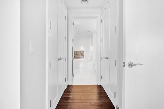 a view of a bathroom from the hallway