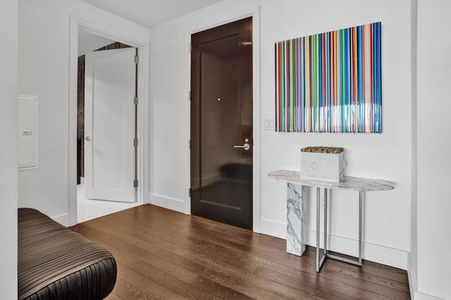 a view of entryway with wooden floor