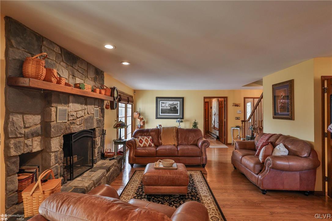 193 Nolf Road Nazareth, PA 18064 - Photo 11 of 47 a living room with furniture a fireplace and a flat screen tv