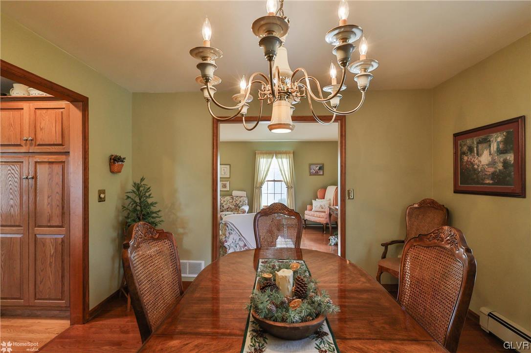 193 Nolf Road Nazareth, PA 18064 - Photo 17 of 47 a living room with furniture and a chandelier