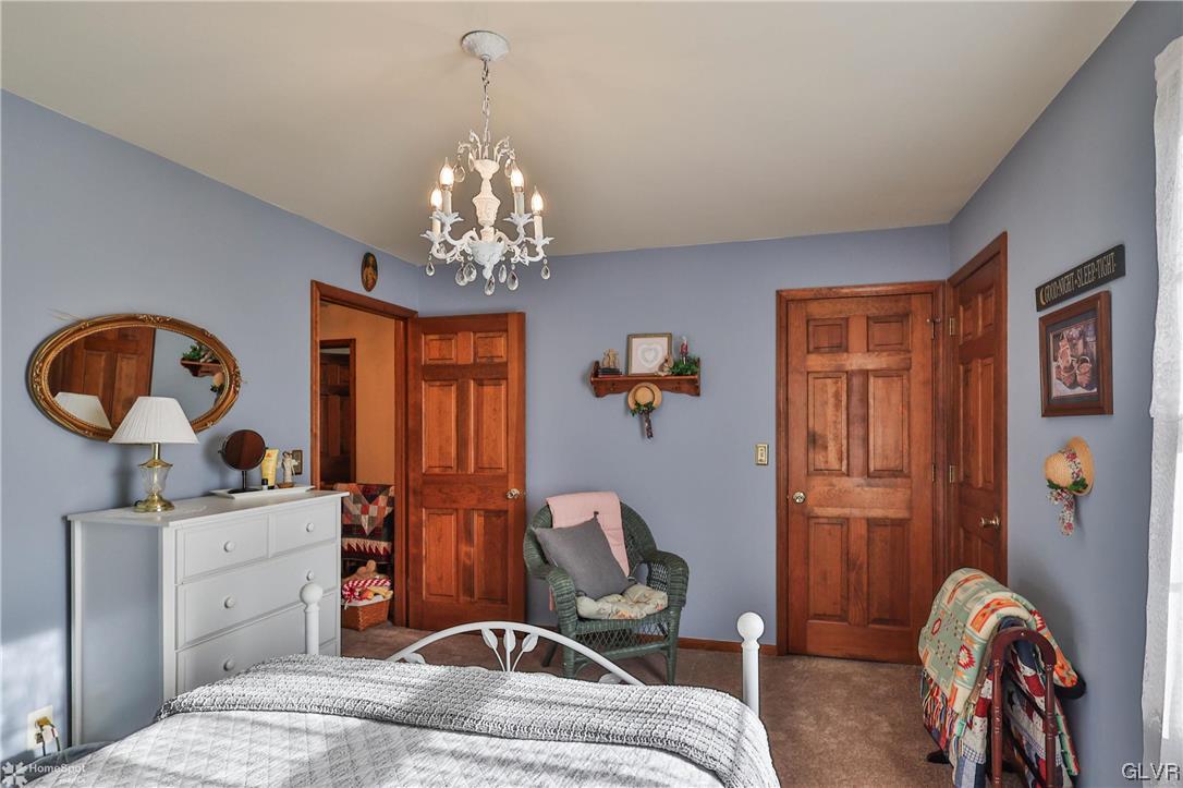 193 Nolf Road Nazareth, PA 18064 - Photo 36 of 47 a bedroom with a bed and wooden floor
