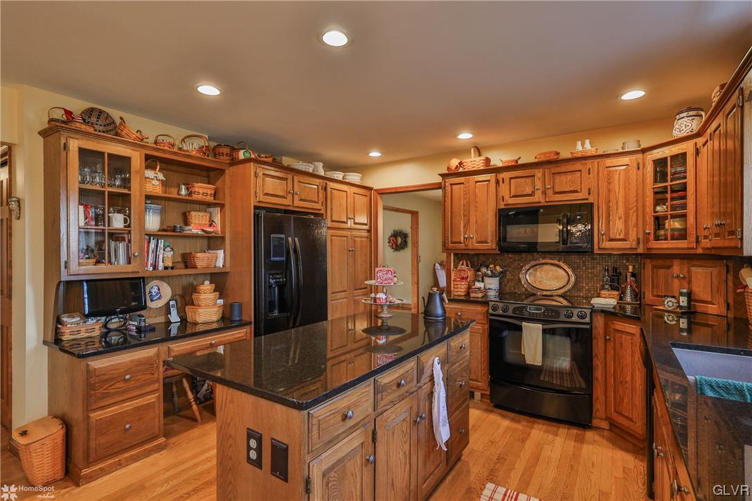 193 Nolf Road Nazareth, PA 18064 - Photo 7 of 47 a kitchen with stainless steel appliances granite countertop a refrigerator and a stove