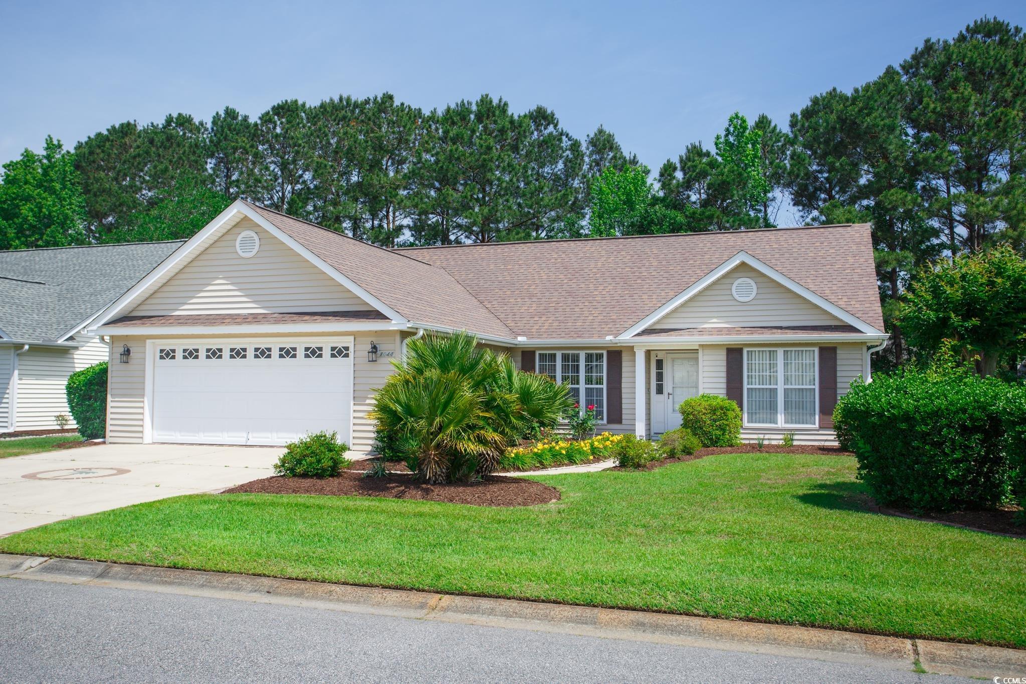 1044 Vestry Drive Murrells Inlet, SC 29576 - Photo 1 of 40 Single story home with an attached garage, drivewa