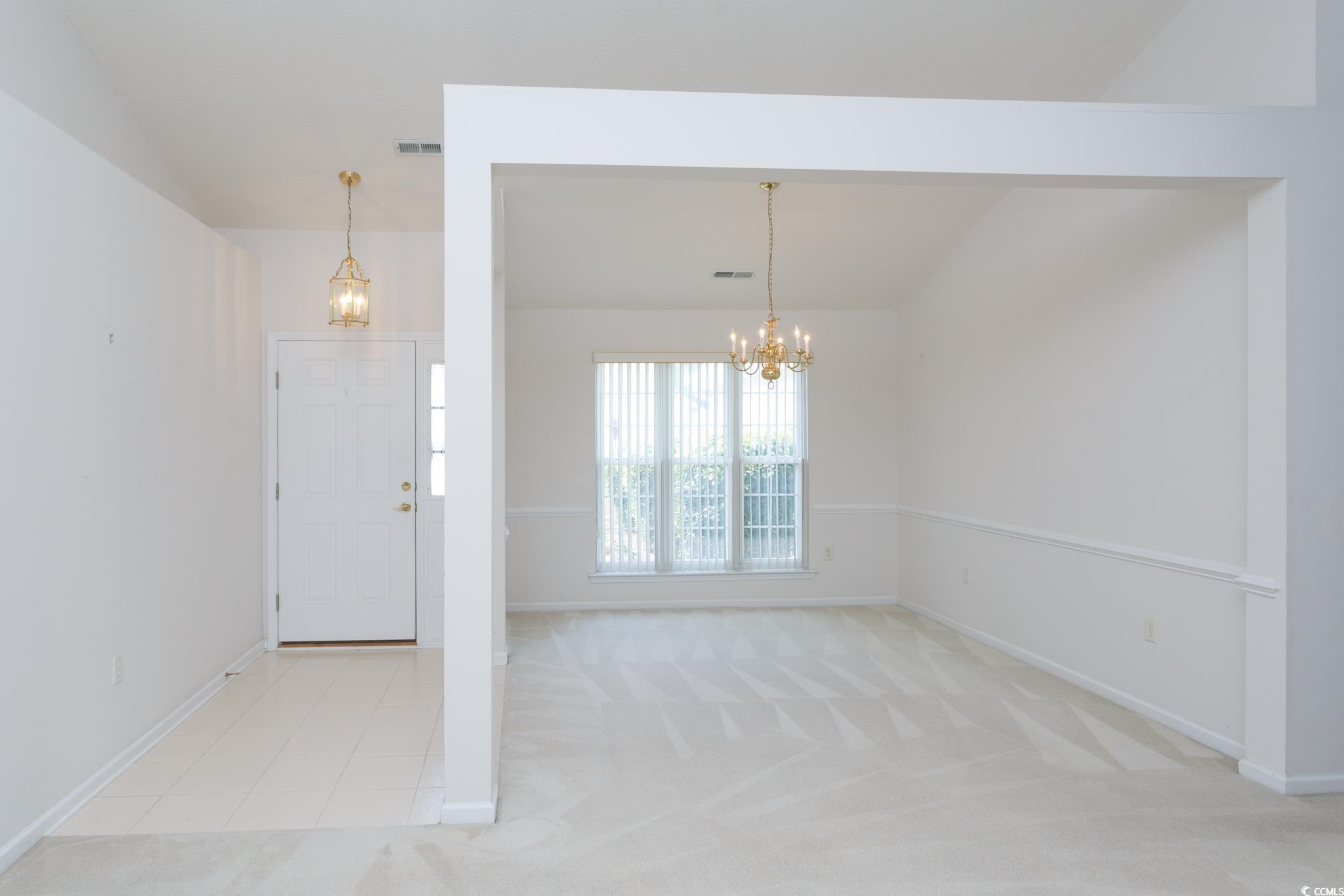 1044 Vestry Drive Murrells Inlet, SC 29576 - Photo 4 of 40 Entrance foyer featuring a chandelier, baseboards,