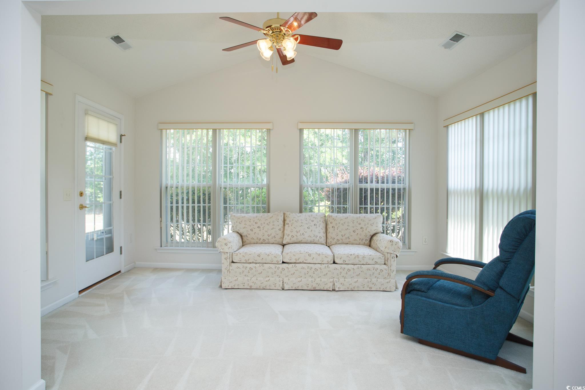 1044 Vestry Drive Murrells Inlet, SC 29576 - Photo 7 of 40 Living area with plenty of natural light, lofted c