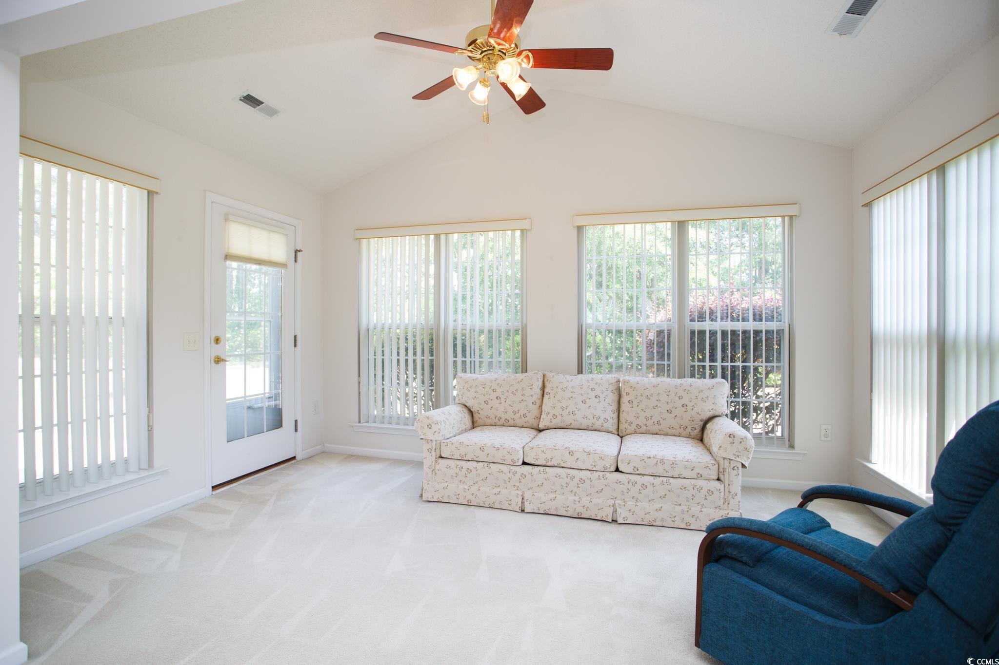 1044 Vestry Drive Murrells Inlet, SC 29576 - Photo 8 of 40 Carpeted living area featuring lofted ceiling, bas