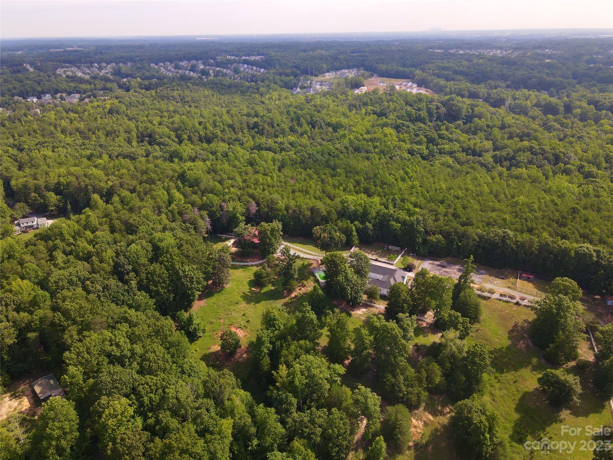 2354 Vineyard Road Fort Mill, SC 29708 - Photo 3 of 48 a view of a lake with a building in the background