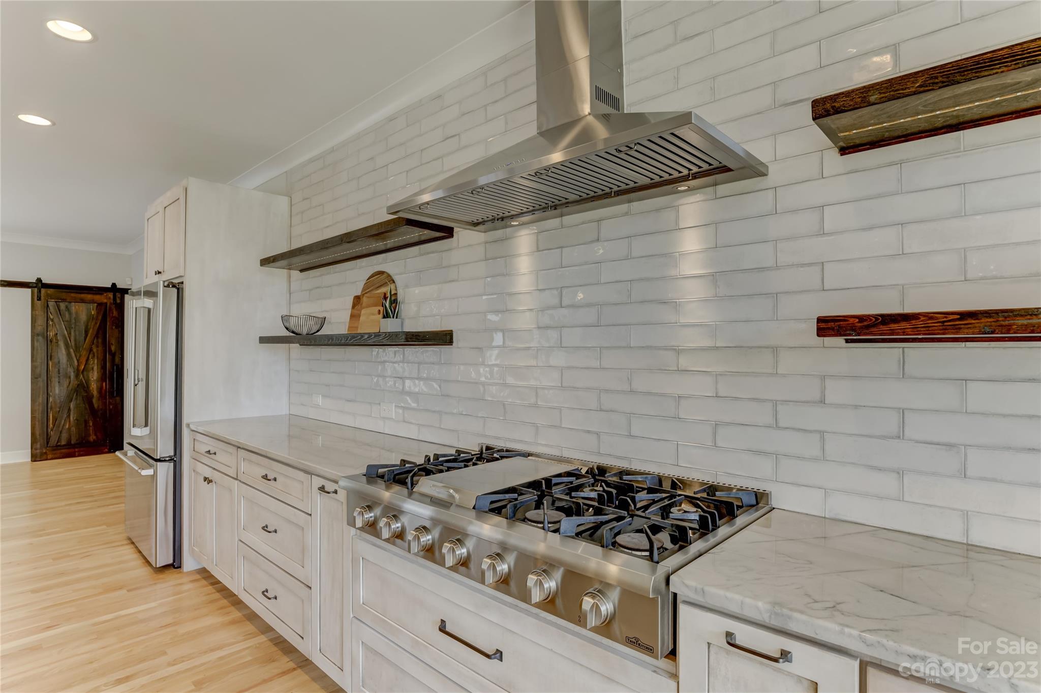 2354 Vineyard Road Fort Mill, SC 29708 - Photo 33 of 48 a kitchen with stainless steel appliances granite countertop a stove and a refrigerator