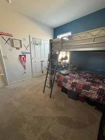 a view of a hallway and a livingroom with furniture