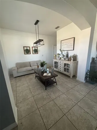 a bedroom with a bed and a ceiling fan