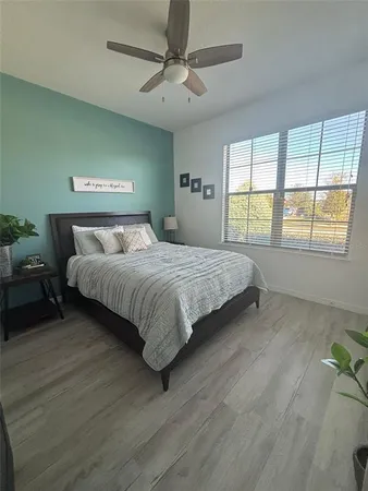 a room with a bed and furniture