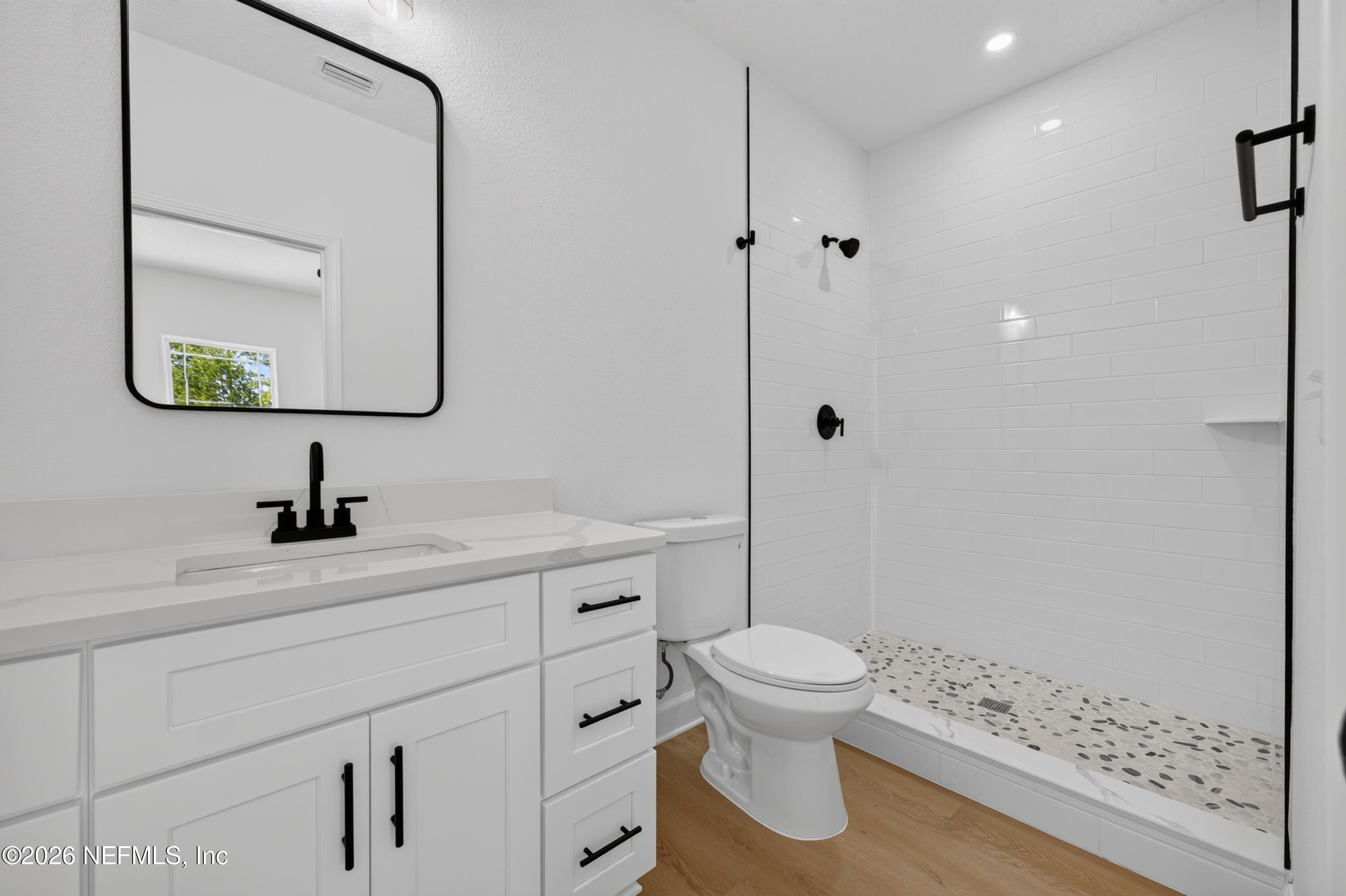 4362 Angora Street Middleburg, FL 32068 - Photo 22 of 31 a bathroom with a sink a toilet and shower