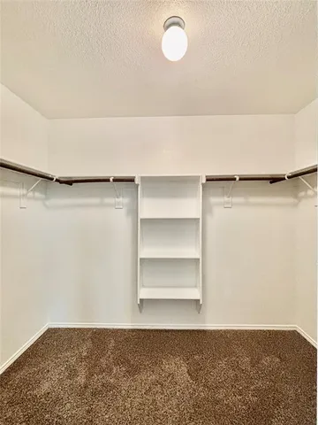 a view of a room with shelf on the wall