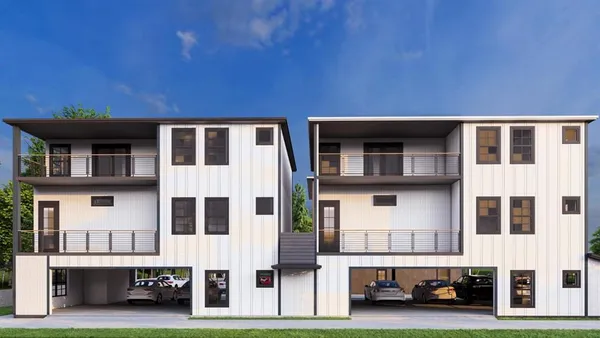 a city view with tall buildings and a yard