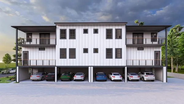 a view of an empty room with windows